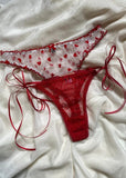 String "NINA VALENTINE" rouge